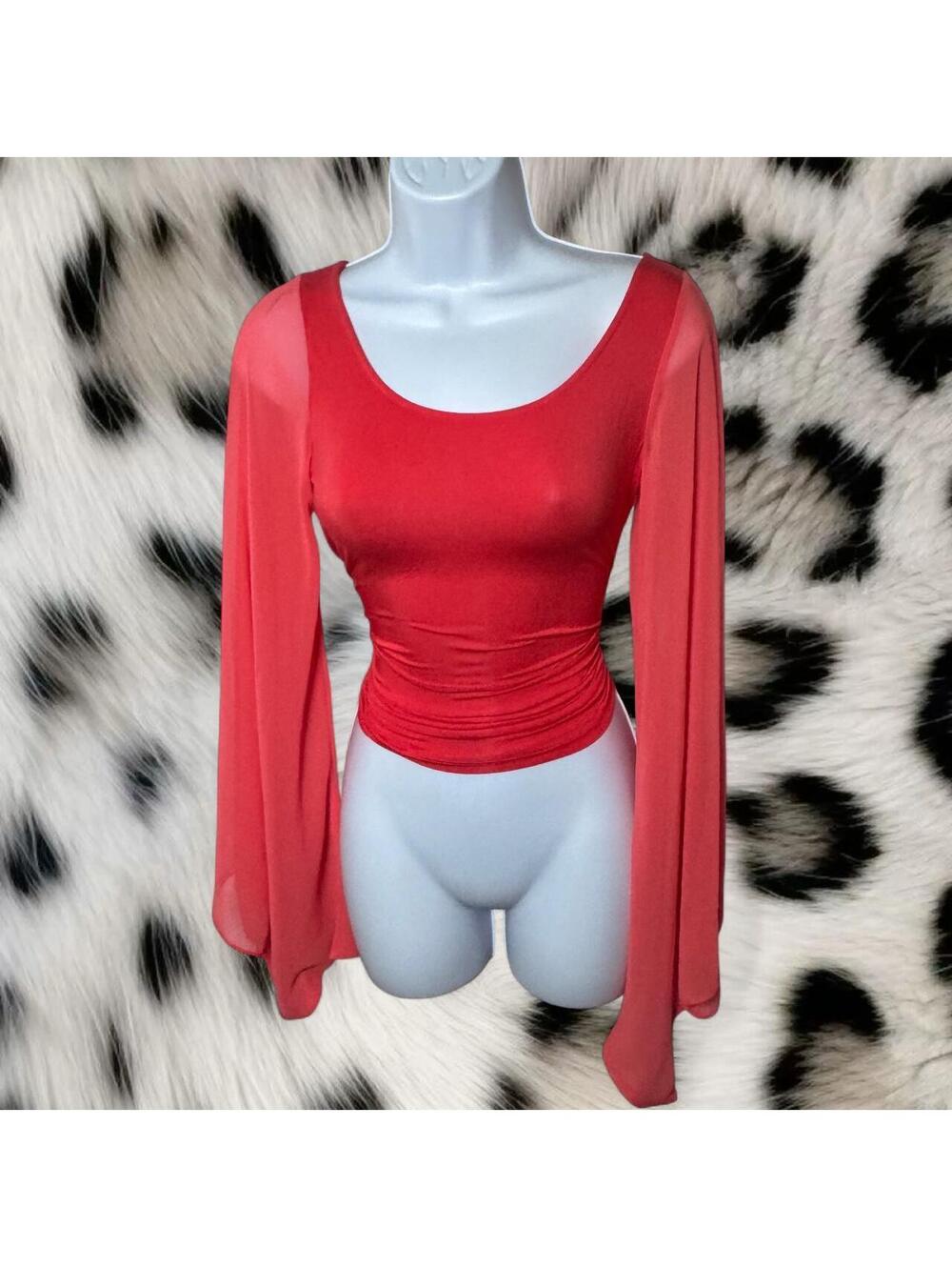 Bebe coral bell sleeve top in size XS.